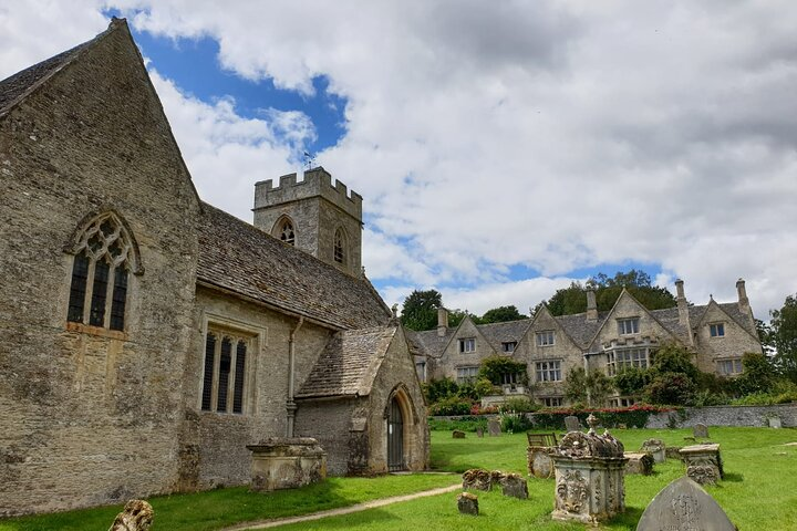 St Nicholas Church with Asthall Manor in the background 